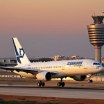 **

"Modern Israeli airliner taking off from Ben Gurion Airport at sunset, showcasing advanced wing design and fuel efficiency. Focus on the aircraft's sleek lines and the airport's bustling activity."

**